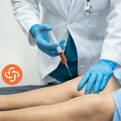 Medical professional in gloves injecting a patient’s knee, representing arthritis therapy, joint pain management, or orthopedic treatment.