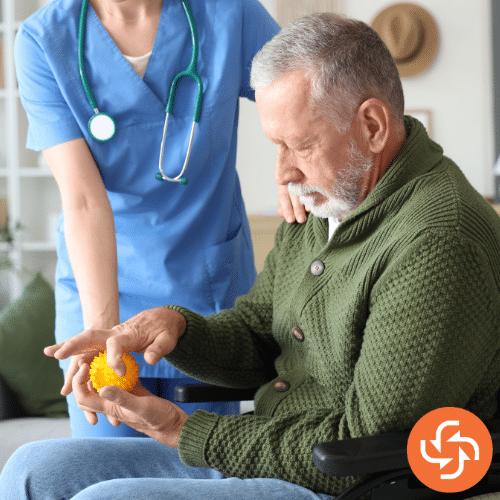 Senior man in a wheelchair holding a pill bottle with a nurse by his side, representing elderly care and medication management.