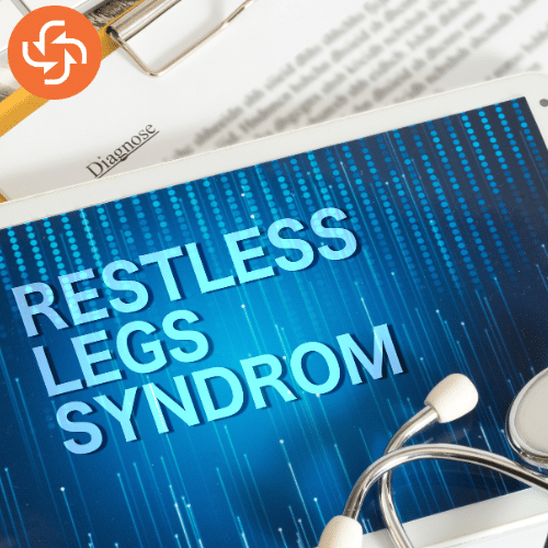 Document with the title Restless Legs Syndrome placed on a desk with a stethoscope, symbolizing awareness of RLS and its impact on sleep health.