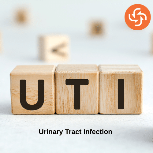 Wooden blocks displaying the letters UTI with the caption Urinary Tract Infection, symbolizing awareness of urinary health issues.