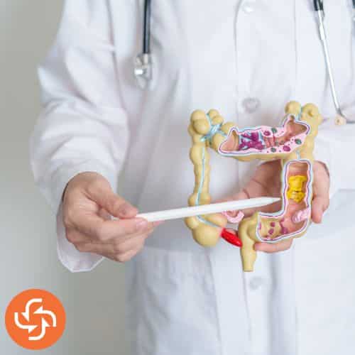 Young woman holding her stomach with a painful expression, highlighting indigestion or stomach pain with a red glowing graphic.